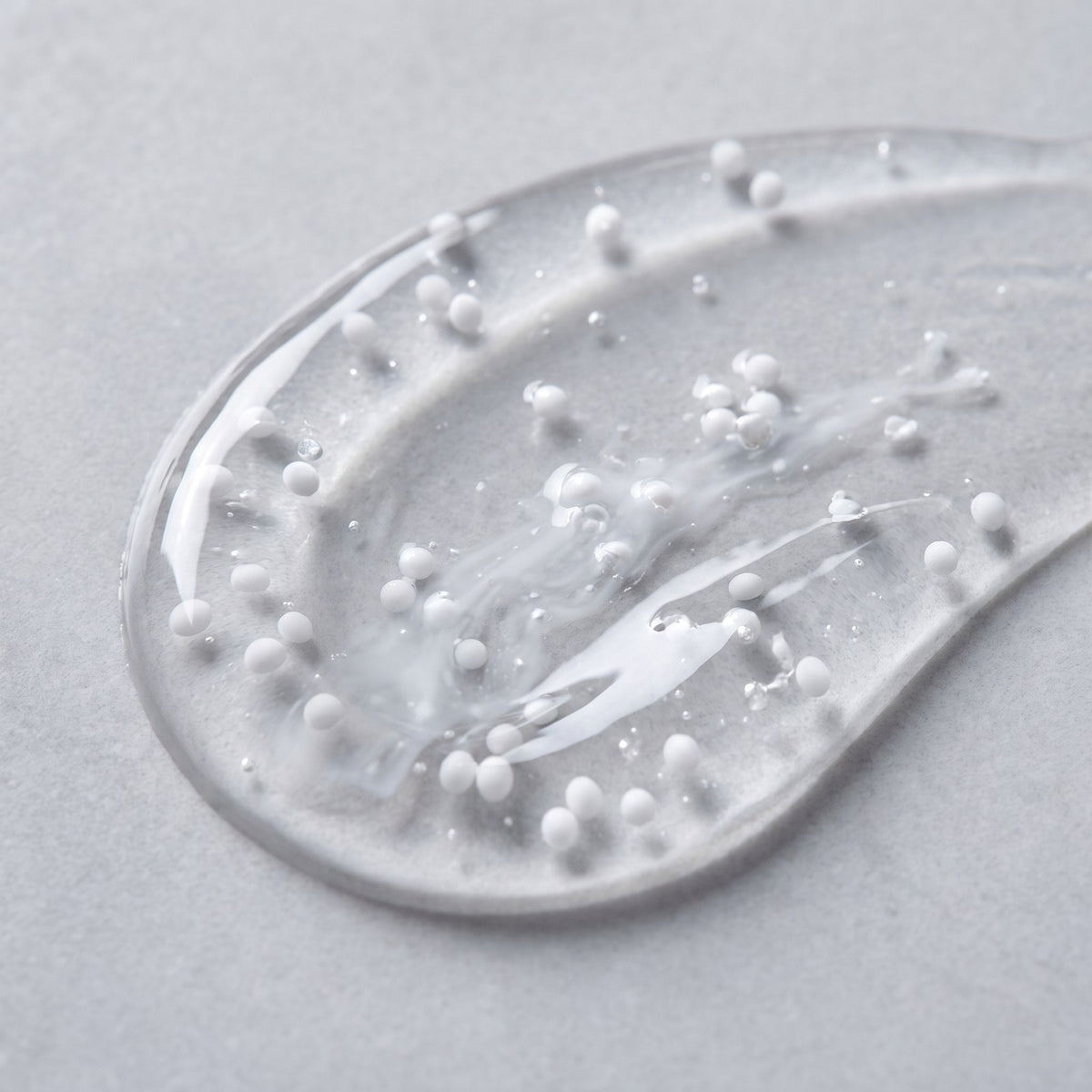 Close-up of the serum texture showing suspended capsules