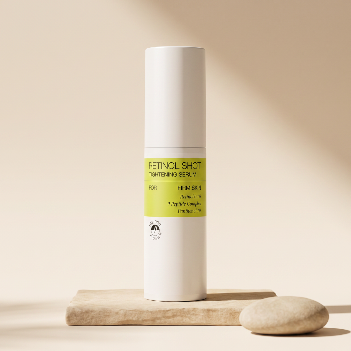 Hoygi Retinal Shot Tightening Serum on warm cream studio background